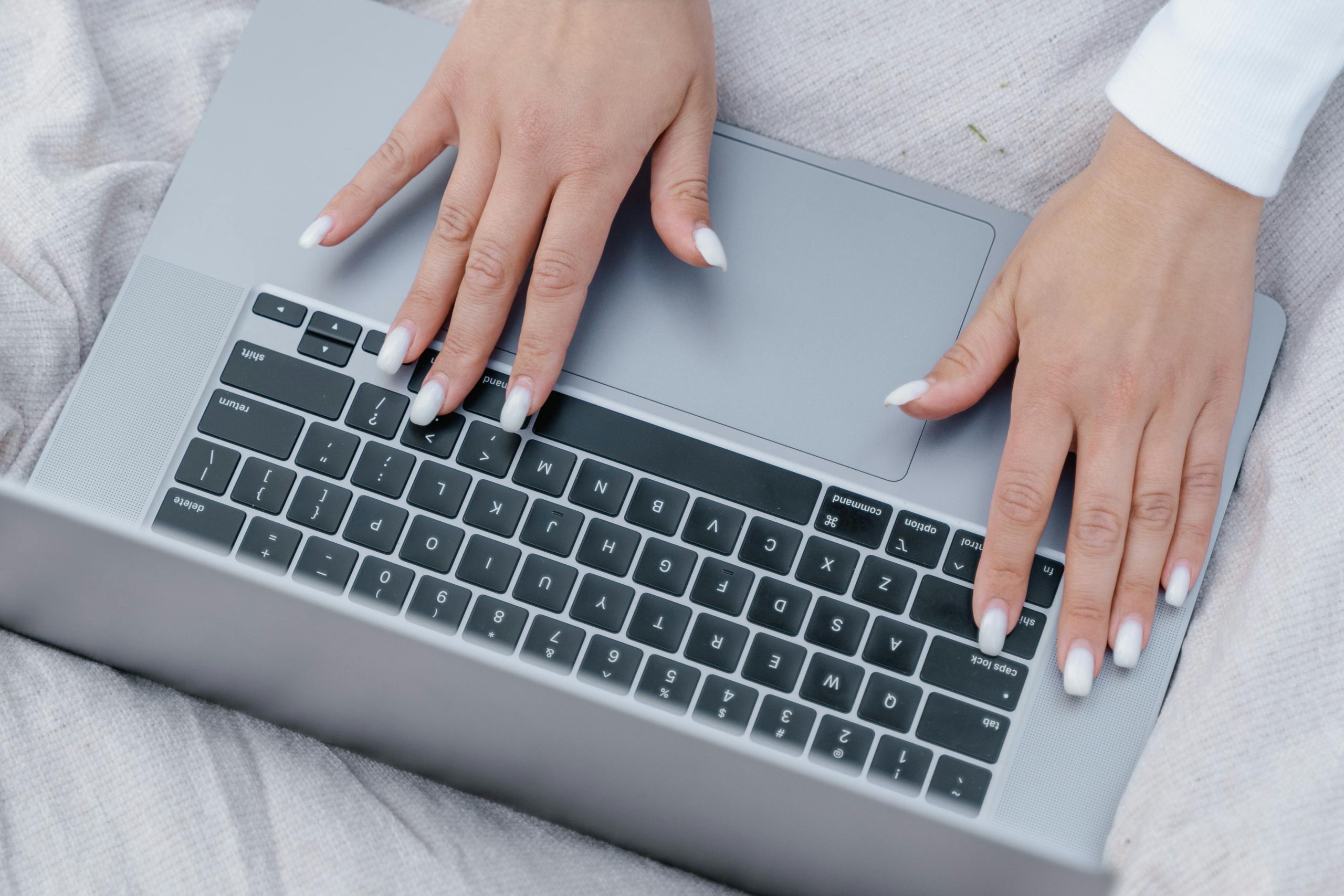 Hands typing on keyboard